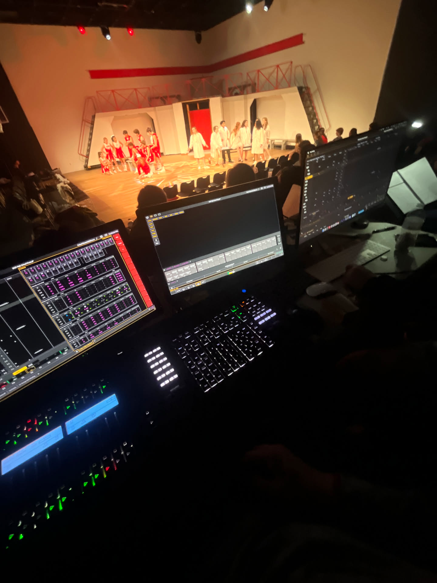 ETC lighting console overlooking a High School Musical rehearsal