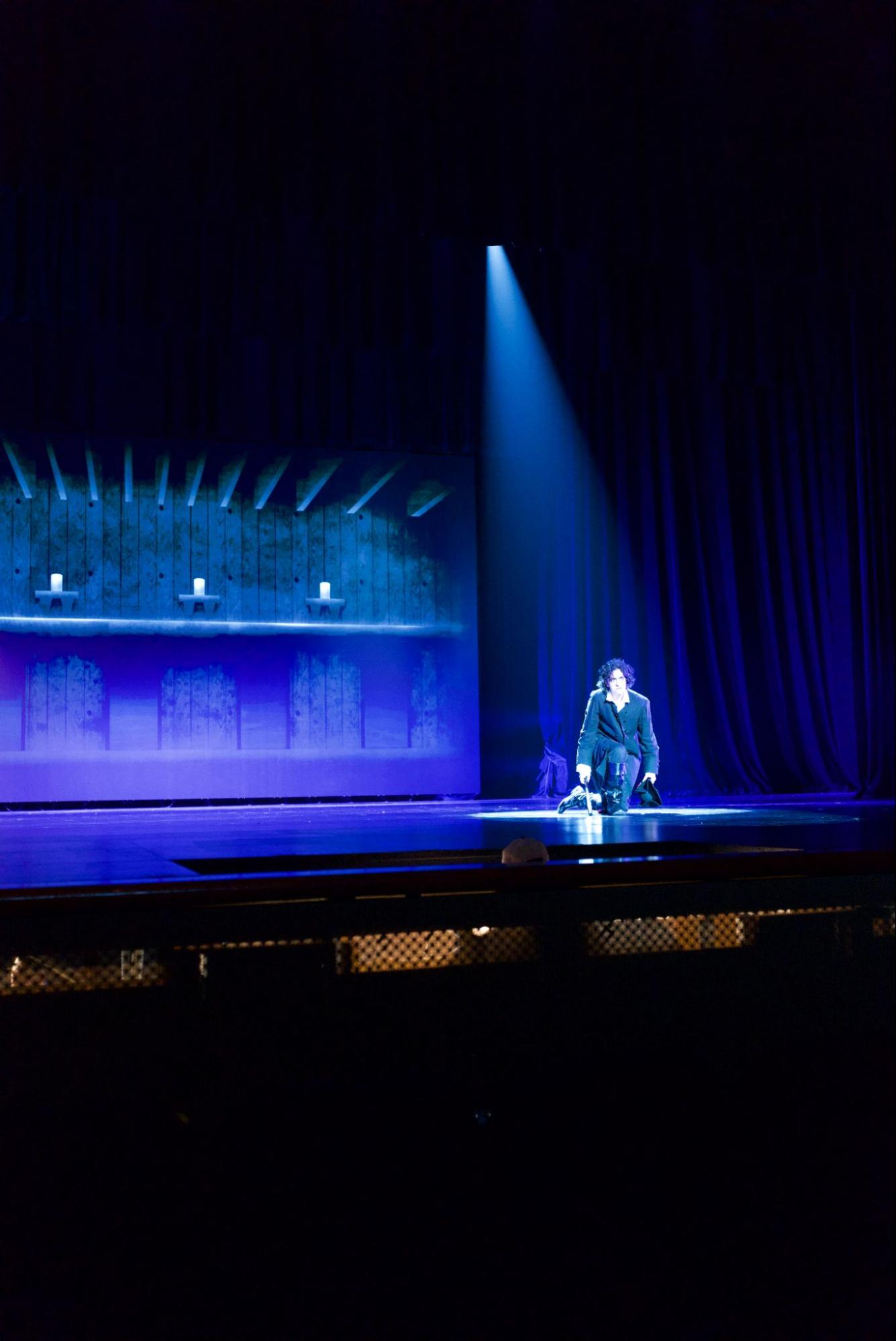 Blue special illuminating a performer in Les Misérables